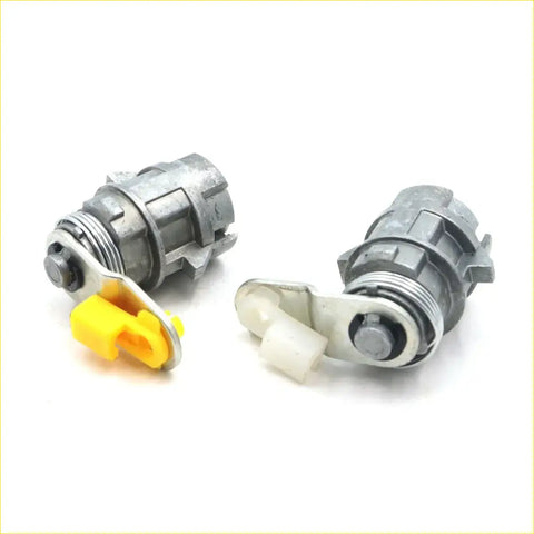 Gray metallic door lock actuators with yellow and white plastic parts for toyota hilux ute 2001-2004 shown from back side
