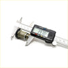 A black digital caliper measuring a brass door lock and retainer clip for toyota hilux ln30 rn33 rn31 rn36 rn39 rn43