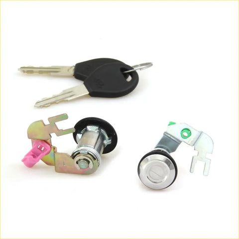 Silver car door lock cylinder with black rubber seal and matching keys for nissan datsun 720 navara ute 1980-1997
