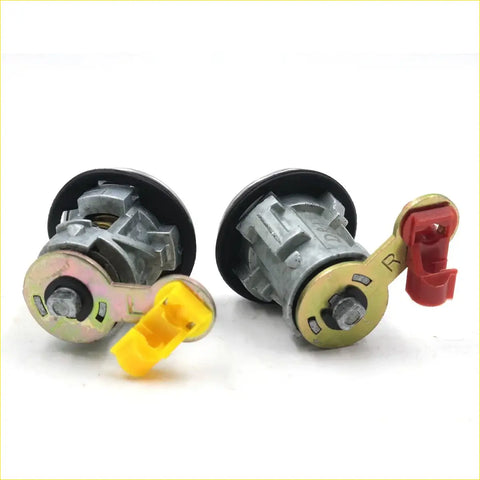 Gray and yellow door lock cylinders with black rubber seals for nissan navara d22 np300 1997-2004 back side view