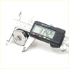 A shiny chrome door lock cylinder being measured with a digital caliper for nissan navara d22 np300 keys