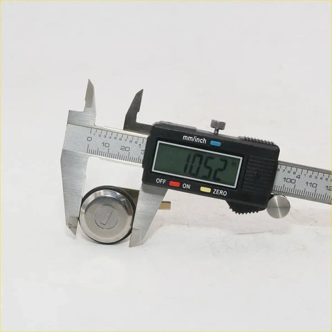 A shiny metallic key for nissan datsun 720 1979-1986 measured at 10.52 mm with digital caliper for door locks