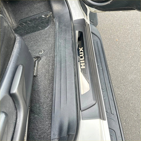 Black plastic door sill plate with silver hilux logo insert for toyota hilux 2015-2025 models
