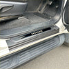 Black plastic door sill plate for Toyota Hilux 2015-2025 with silver hilux logo lettering