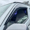 Black plastic door visor installed on white toyota hiace 2005-2019 for monsoons weather shields oem style