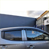 Silver Mitsubishi Triton with black window monsoons door visors for weather shields shown from rear side