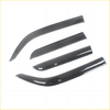 Set of four black glossy car window visors with curved edges for weather protection on nissan navara d40