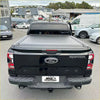 Black ford raptor pickup truck back with sleek matte-finish electric roller shutter tonneau cover for ford ranger 2022+