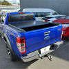 Blue ford ranger xlt pickup truck from the back with a black electric roller shutter tonneau cover for px1 px2 px3 models