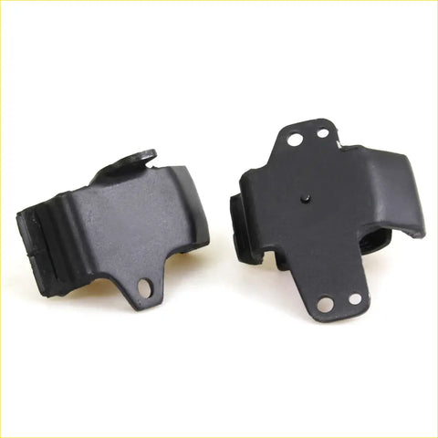 Black rubber engine mount brackets with molded plastic reinforcements and mounting holes for nissan d21 2.5l 86-89