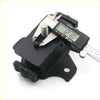 Black plastic engine mount with silver bolt and digital caliper for toyota hilux double cab 2015-2023