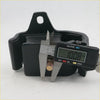 Black rubber engine mount with brass bolt being measured by digital caliper for nissan datsun d21 td25 1985-1999