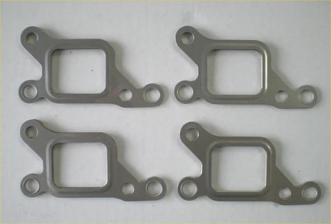 Four metallic gray exhaust manifold gaskets arranged in a square for challenger l200 mitsubishi shogun 2.8td 2.8tdi 4m40t