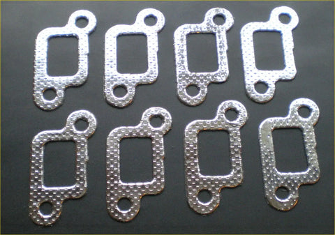Silver metallic exhaust manifold gasket with textured perforated surface and rectangular cutout for land rover discovery v8