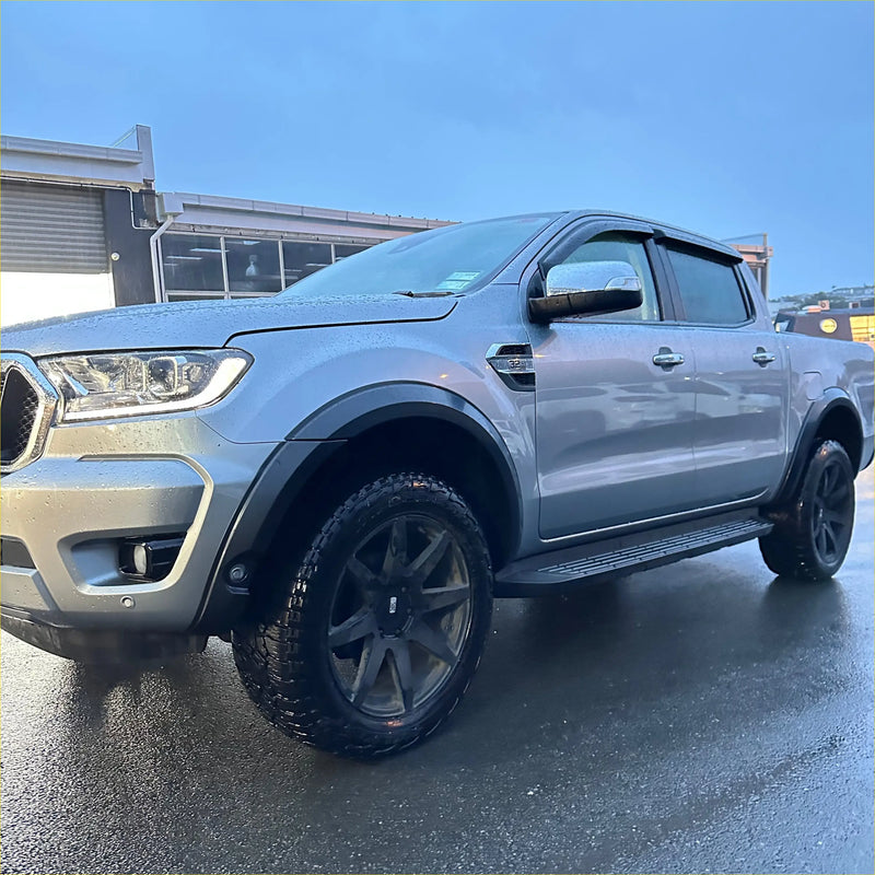 Silver ford ranger px3 2019-2021 with black wheels and side steps featuring smooth style 4-inch fender flares with senor