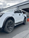 White isuzu d-max 2024 with matte black 4-inch fender flares black wheels and side steps shown from the back