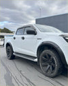 White isuzu d-max 2024+ with matte black 4-inch fender flares black wheels and side steps front view