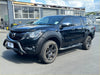 Black mazda bt-50 pickup with matte black 9-inch bolt style fender flare and black alloy wheels