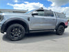 Silver ford ranger wildtrak with matte black sport smooth style double fender flares black wheels and roof rack