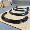 Black glossy finished matte black 4-inch smooth style fender flares for isuzu d-max 2016-2020 on cardboard