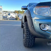 Blue metallic ford ranger with black lychee texture bolt style fender flares and rugged off-road tires for px1 2012-2015