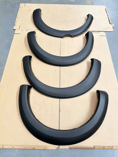 Set of four black plastic matte finish fender flares with curved design for mitsubishi triton 2015-2018