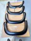 Black matte finish smooth style fender flares for Mitsubishi Triton 2019-2023 shown from the back side
