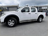 White nissan navara d40 pickup with smooth style matte black fender flares black trim and silver alloy wheels