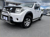 White nissan navara d40 pickup with matte black smooth style fender flares chrome bull bar and black side steps