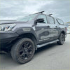 Dark gray toyota hilux sr5 cruiser with black wheels and off-road tires featuring grey layer fender flares 2015-2020