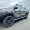 Dark gray metallic toyota hilux with black wheels and srs cruiser decals featuring grey layer surface oem style fender flares