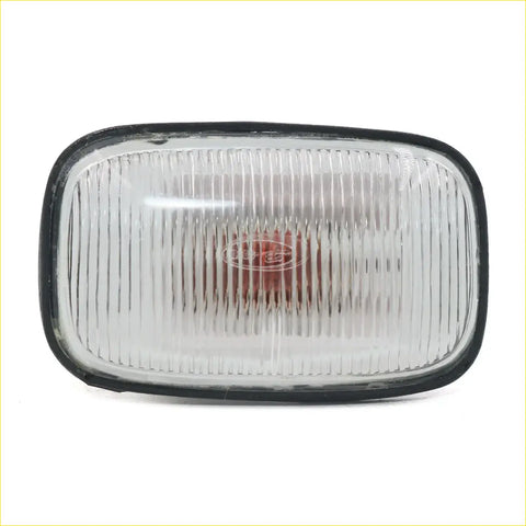 Black-framed clear ribbed plastic fender guard repeater side indicator light with red lens for toyota hilux 1997-2005