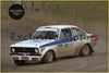 White and blue ford escort mk2 rally car with dirt splattered body and racing number 11 featuring alloy front spoiler