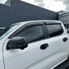 Black plastic door visors installed on white ford ranger 2022 plus pickup truck for weather shield protection