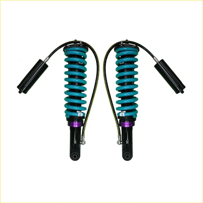 A pair of teal-coiled dobinsons monotube suspension shocks with black and purple accents for ford ranger px1 px2