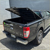 Black ford ranger xlt pickup truck with lifted tailgate and chrome accents featuring ford ranger tomahawk aluminium hardlid back view