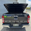 Black ford ranger xlt pickup truck with glossy finish and chrome accents featuring tomahawk aluminium hardlid