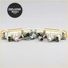 A pair of off-white plastic front bumper indicators with amber lenses and wiring for mitsubishi triton ute