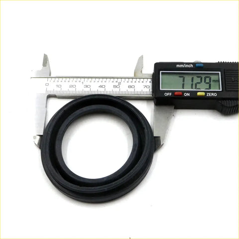 Black rubber seal ring of front caliper dust cover for Mitsubishi l200 triton 1996-2015 being measured with caliper