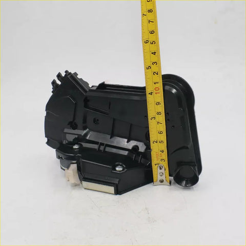Black plastic front side door lock actuator with internal gears and mounting hardware for Toyota Hilux Revo 2015-2017