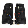 Black plastic front signal light assemblies for Nissan Datsun 720 ute 1980-1989 showing backside wiring and mounts