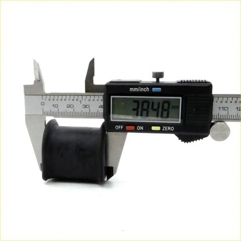 Black rubber front stabilizer shaft bushing being measured by digital caliper for toyota hilux 1979-1983