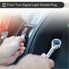 Silver metal front turn signal light socket plug being installed into toyota 4runner headlight assembly back side