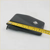 Black plastic fuel door cover for Nissan Hardbody Pathfinder 1985-1999 with circular cutout and angular design back view