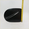 Black glossy plastic fuel door cover with smooth curved surface and central indentation for nissan navara d40