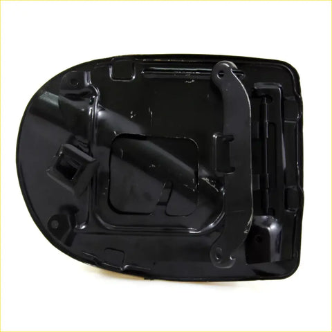 Black plastic fuel door cover with molded contours and integrated latch for nissan navara king cab d40 2007-2014