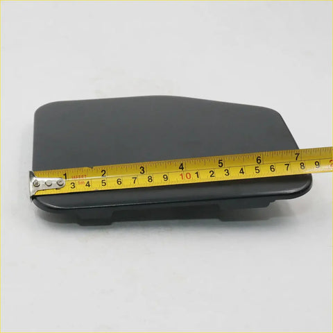 Black plastic fuel door cover for Toyota Hilux RN80 N90 N100 with smooth matte finish and rounded edges
