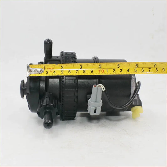 Black plastic fuel filter assembly pump with yellow tape for toyota hilux kun26 2004-2016 shown from above