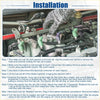 A hand wearing textured gray glove holds a metallic fuel rail with green and purple injectors for Toyota Tacoma 2.7L
