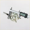 Silver metallic fuel pump with three tubes and digital caliper measuring 1.052 inches for nissan pulsar n10